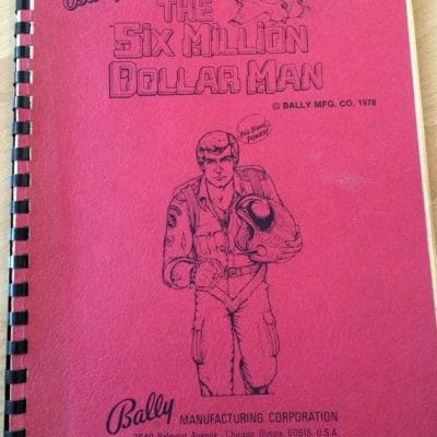 Bally Six Million Dollar Man pinball manual red cover with bionic man character illustration 1978