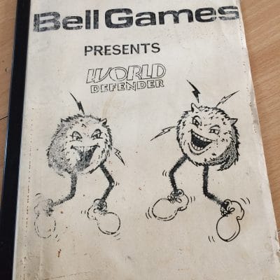 Bell Games World Defender pinball manual worn white cover with cartoon monster characters